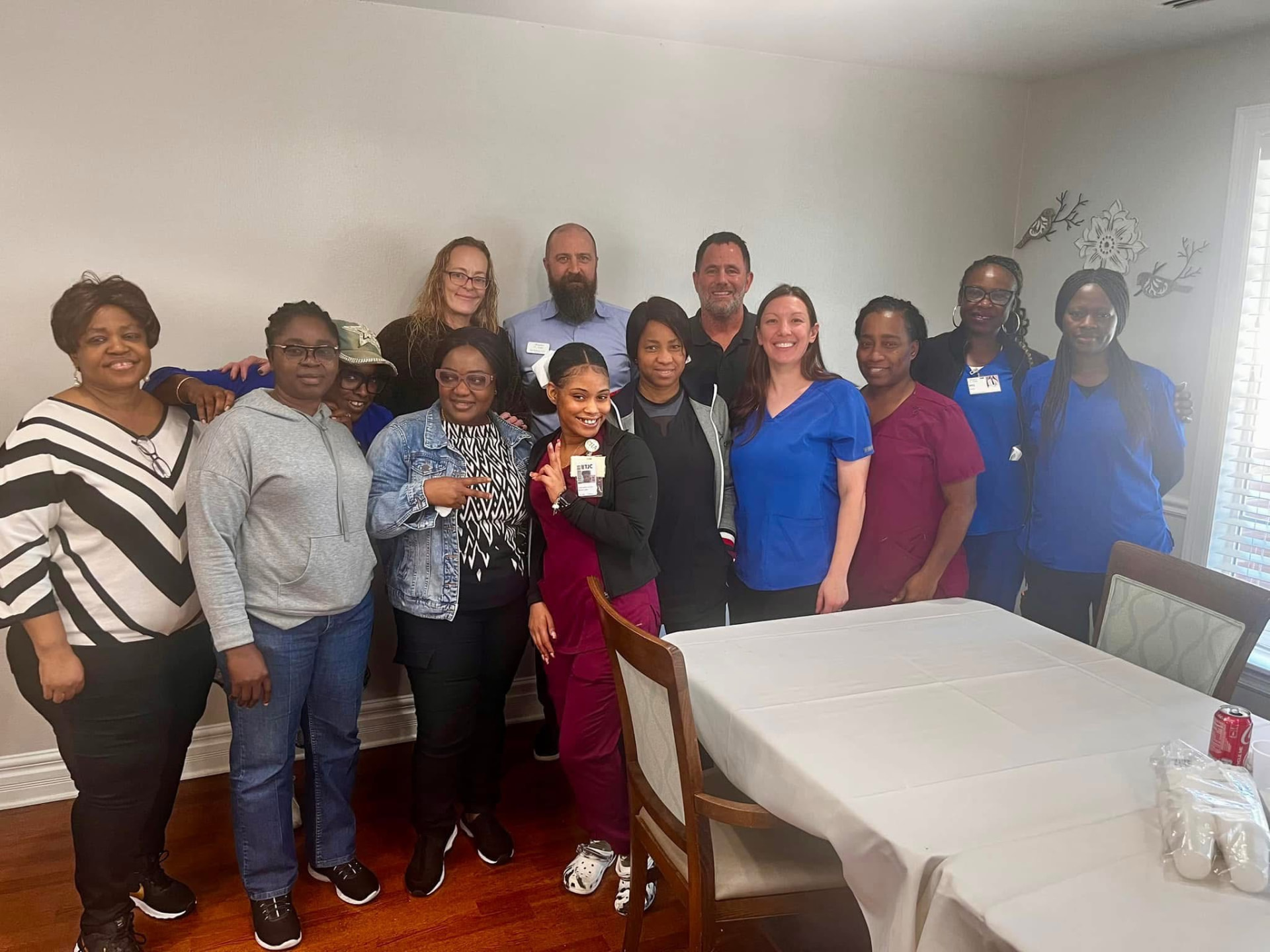 A care team gathered around the table after a workshop
