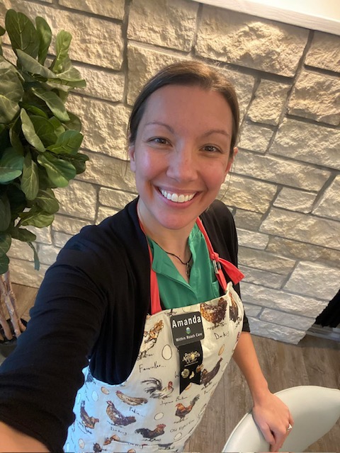 Amanda smiling in her Within Reach Care apron