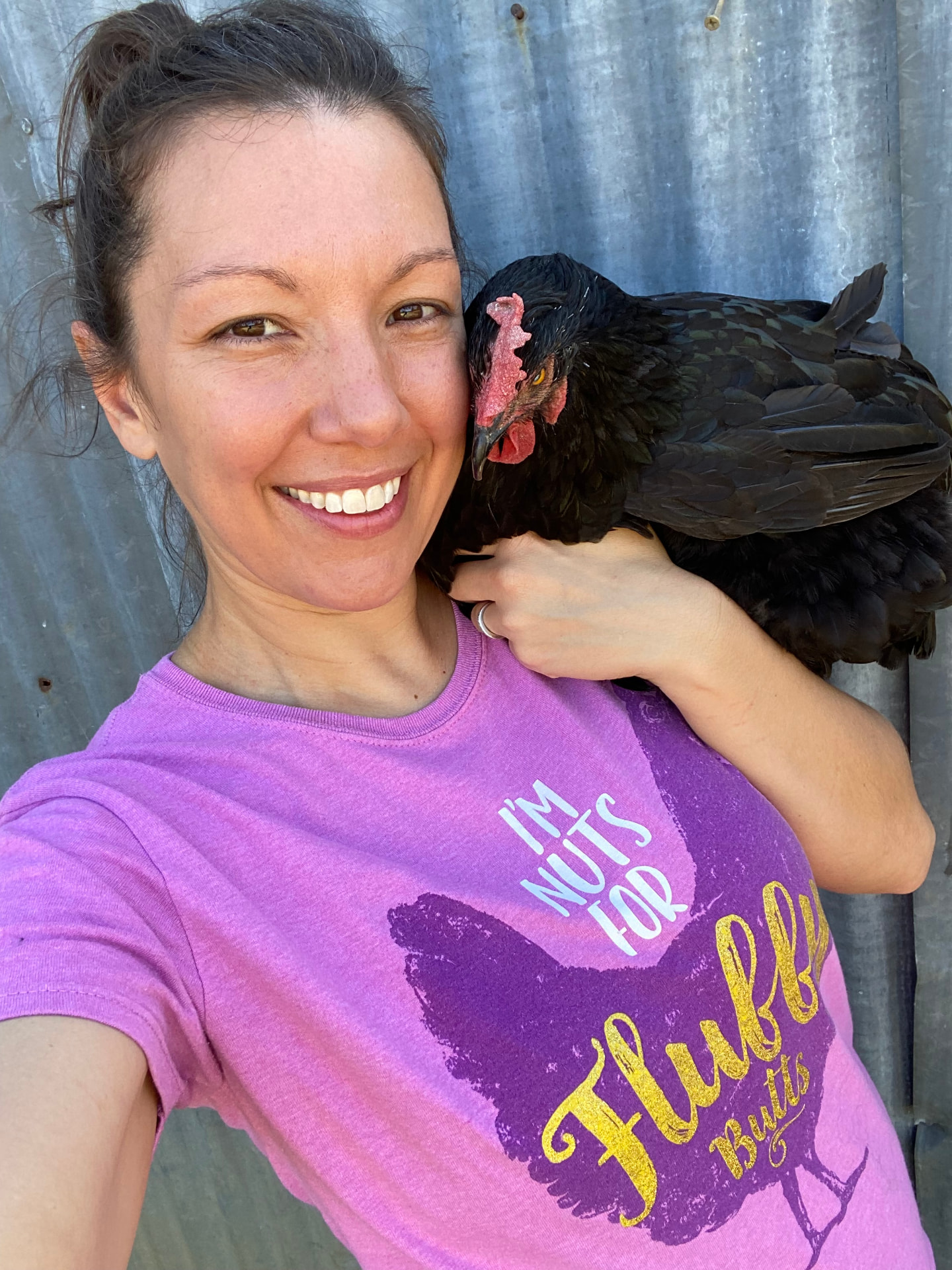 Amanda holding her favorite chicken on the ranch