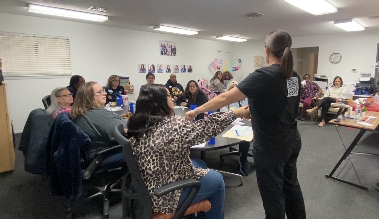 Care staff practicing a hands-on skill during a workshop